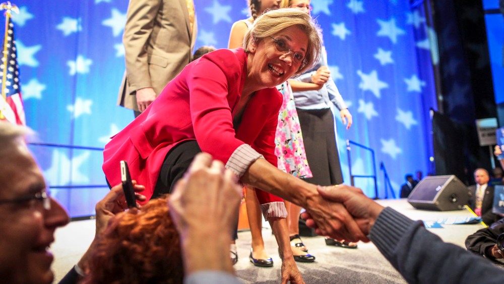 Elizabeth Warren greets the crowd after winning the nomination during the 2012 Massachusetts Democratic Endorsing Convention in Springfield, Mass.