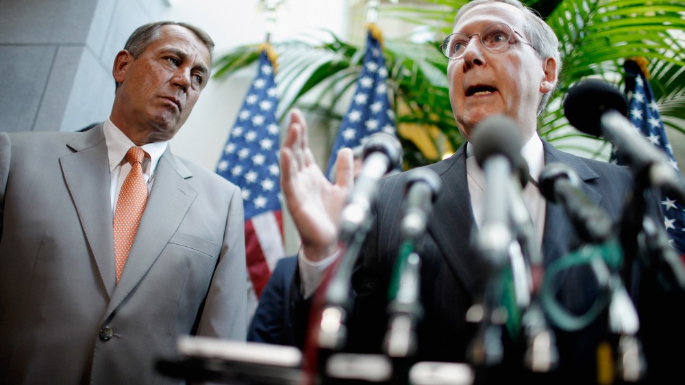 Senate Minority Leader Mitch McConnell (R-KY) (R) speaks with Speaker of the House John Beohner (R-OH) in Washington in 2012.