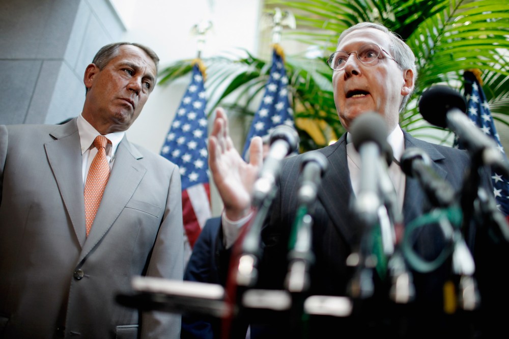Senate Minority Leader Mitch McConnell (R-KY) (R) speaks with Speaker of the House John Beohner (R-OH) in Washington in 2012.