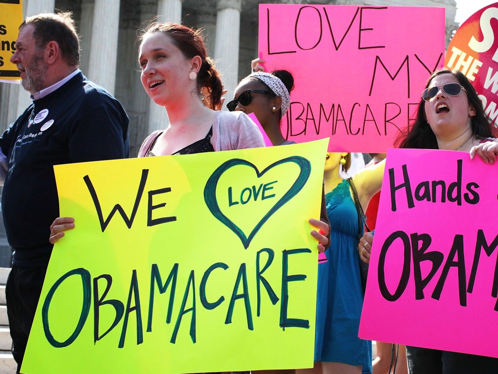File Photo: Obamacare supporters demonstrate in front of the U.S. Supreme Court June 28, 2012 in Washington, DC. The Supreme Court is expected to hand down its ruling on the Affordable Healthcare Act this morning.  (Photo by Alex Wong/Getty Images/File)