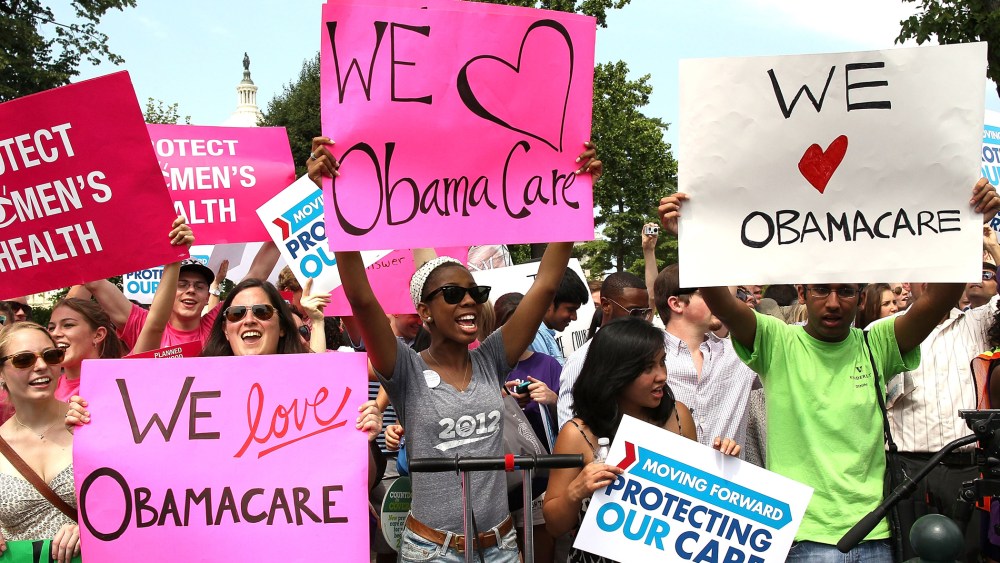 Obamacare supporters react to the  U.S. Supreme Court decision to uphold President Obama's health care law, on June 28, 2012 in Washington, D.C.