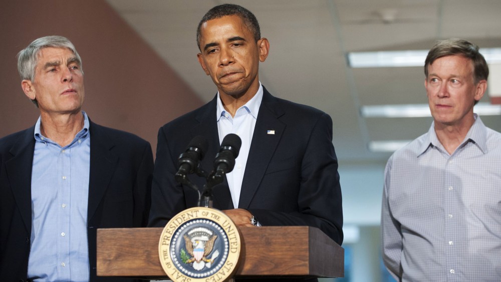US President Barack Obama speaks alongside Colorado Senator Mark Udall and Colorado Governor John Hickenlooper (R) at the University of Colorado Hospital in Aurora, Colorado, July 22, 2012.