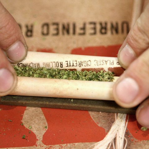 A "budtender" rolls a marijuana cigarette for a patient at Perennial Holistic Wellness Center medical marijuana dispensary, on July 25, 2012 in Los Angeles, California.