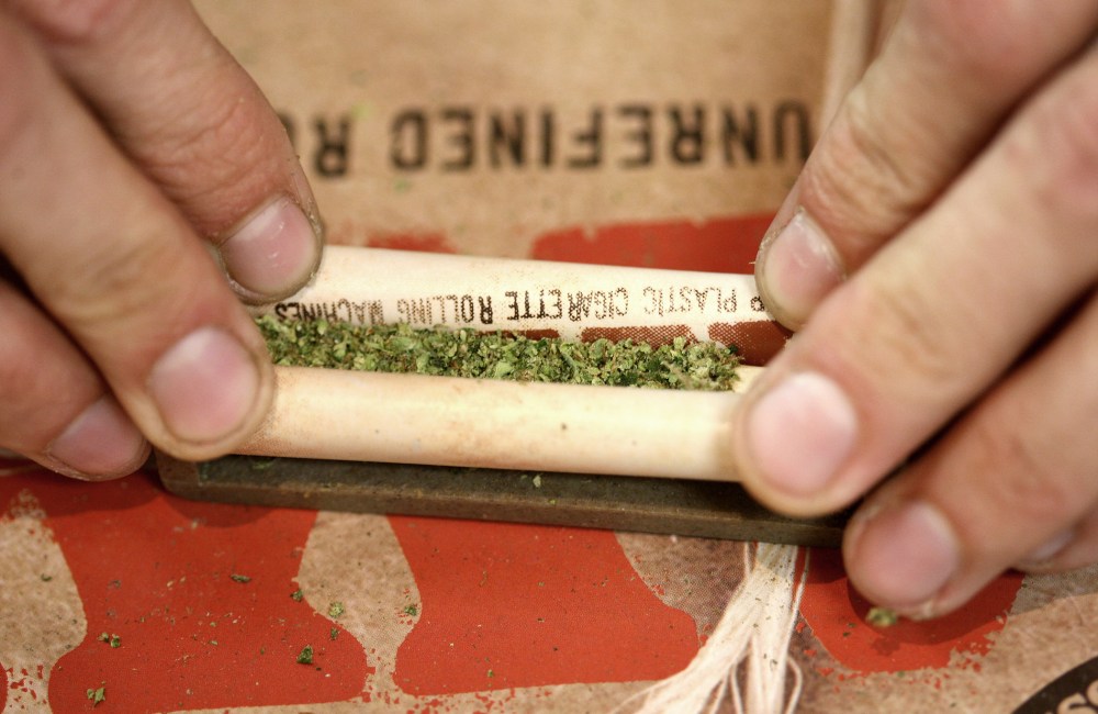 A "budtender" rolls a marijuana cigarette for a patient at Perennial Holistic Wellness Center medical marijuana dispensary, on July 25, 2012 in Los Angeles, California.