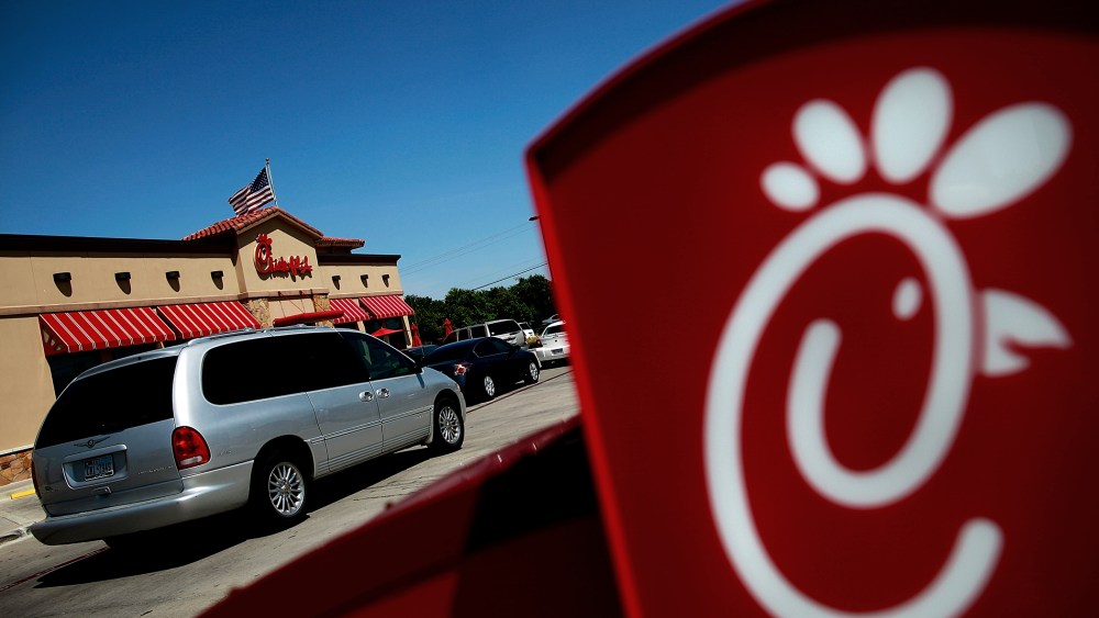 Drive through customers wait in line at a Chick-fil-A restaurant on in Fort Worth, Texas.  (Photo by Tom Pennington/Getty Images)