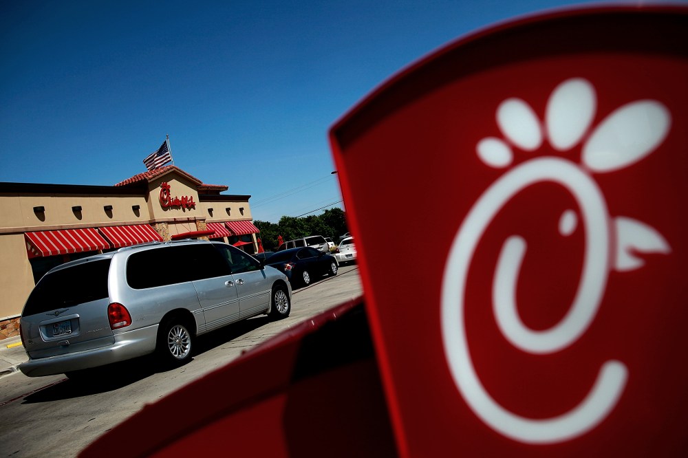 Drive through customers wait in line at a Chick-fil-A restaurant on in Fort Worth, Texas. (Photo by Tom Pennington/Getty Images)