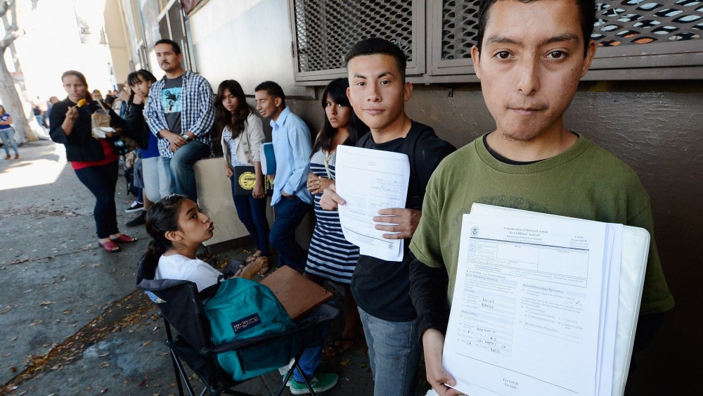 Roberto Larios, 21, holds Deferred Action for Childhood Arrival application as he waits in line with hundreds of fellow undocumanted immigrants at the Coalition for Humane Immigrant Rights of Los Angeles offices to apply for deportation reprieve on...