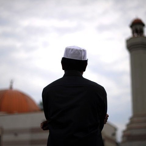 A Muslim takes part in a special morning prayer to start Eid-al-Fitr festival, marking the end of their holy fasting month of Ramadan.