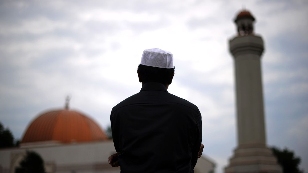 A Muslim takes part in a special morning prayer to start Eid-al-Fitr festival, marking the end of their holy fasting month of Ramadan.