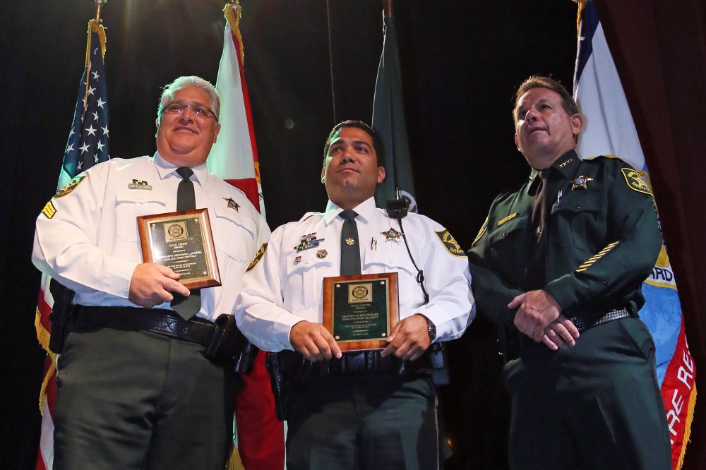 Sgt. Richard LaCerra, left, and Deputy Peter Peraza received Gold Cross Awards from Sheriff Scott Israel during the Broward Sheriff's Office Awards Ceremony, Oct. 22, 2013, in Fort Lauderdale, Fla. (Photo by Amy Beth Bennett/Sun Sentinel)