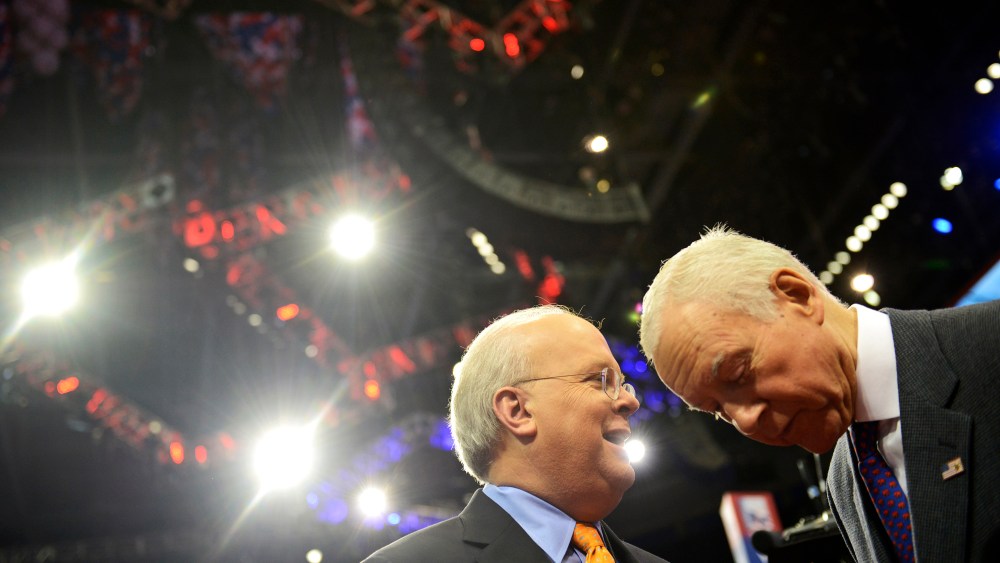 American political consultant Karl Rove and Senator Orrin Hatch from Utah share a word at the Republican National Convention on August 27, 2012.