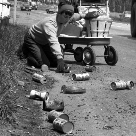 On the first Earth Day, Terry Seuss, 14, cleans up soda and beer cans on Route 17 in Hohokus, N.J., April 22, 1970. (Photo by Jerry Kinstle/NY Daily News/Getty)