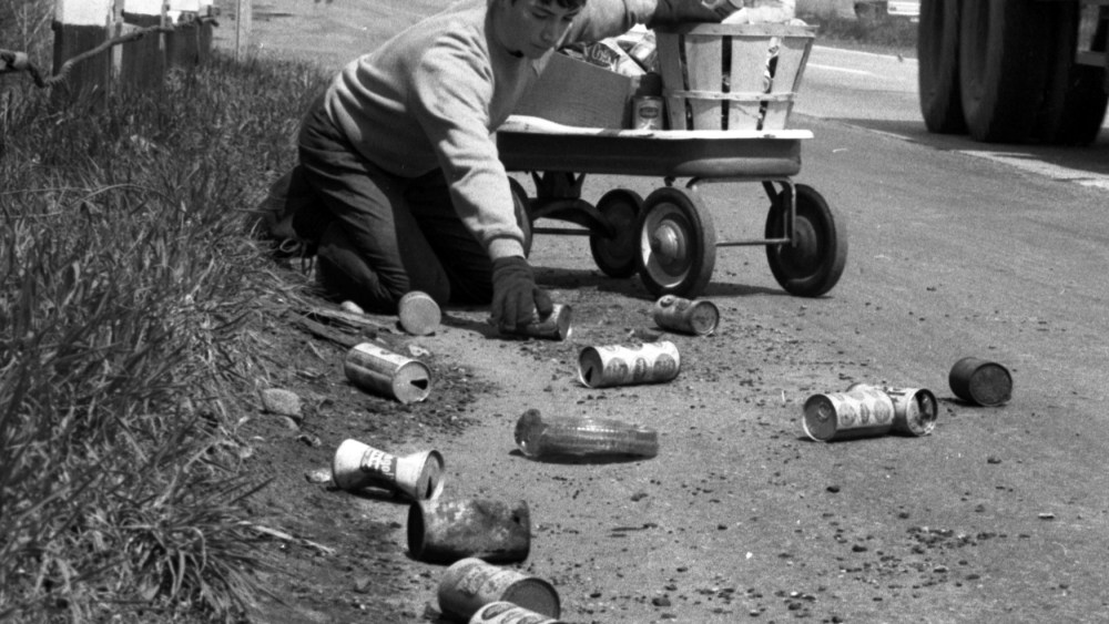 On the first Earth Day, Terry Seuss, 14, cleans up soda and beer cans on Route 17 in Hohokus, N.J., April 22, 1970. (Photo by Jerry Kinstle/NY Daily News/Getty)