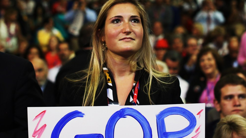 A woman holds a handmade campaign sign during the 2012 RNC on August 29, 2012 in Tampa, Florida.