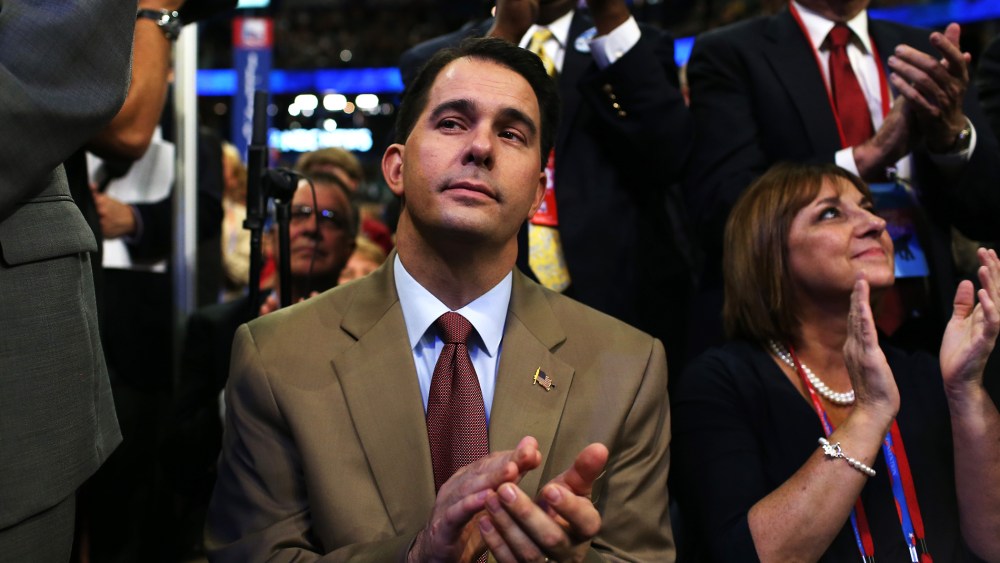 Wisconsin Gov. Scott Walker claps during the third day of the Republican National Convention at the Tampa Bay Times Forum on Aug. 29, 2012 in Tampa, Fla.