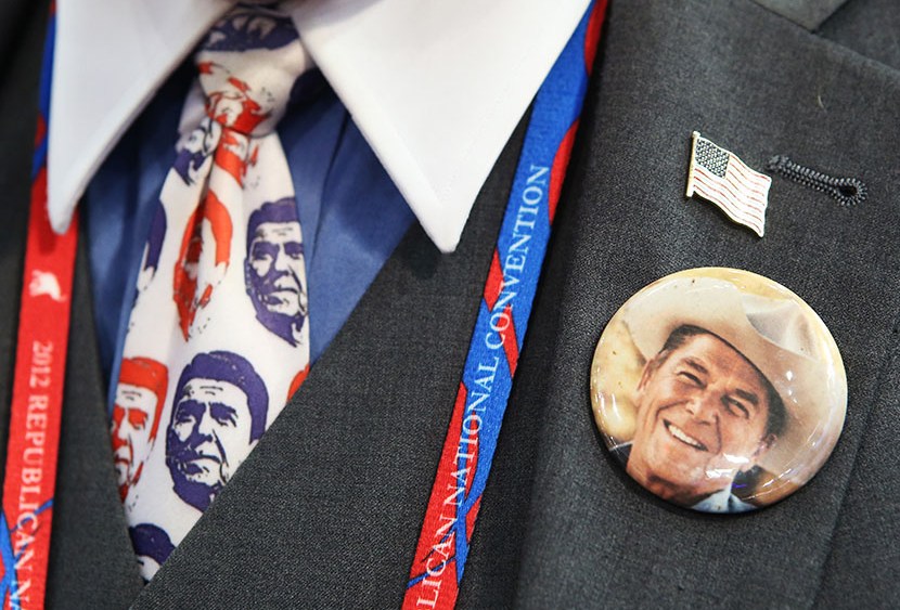 A convention-goer wears a former President Ronald Reagan button and tie during the final day of the Republican National Convention at the Tampa Bay Times Forum on August 30, 2012 in Tampa, Florida. (Photo by Chip Somodevilla/Getty Images)