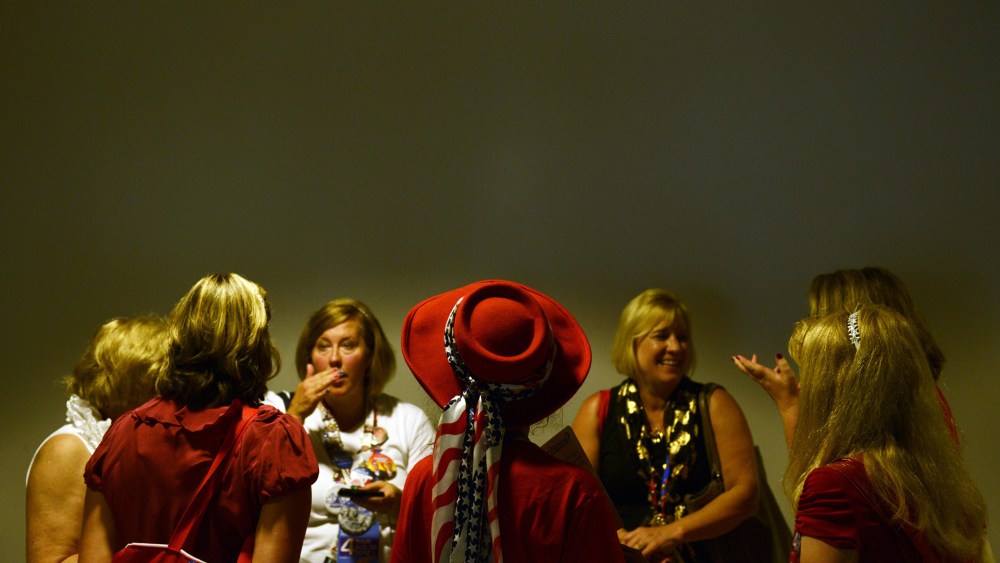 Women confer in the hallway at the Tampa Bay Times Forum in Tampa, Florida, on August 30, 2012 before the day's Republican National Convention events.