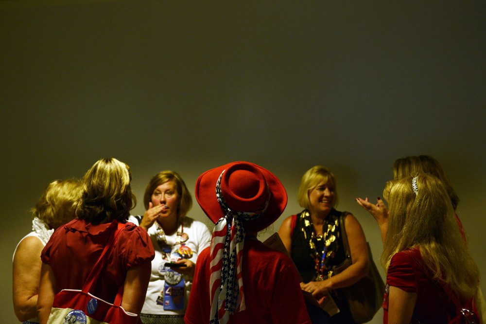 Women confer in the hallway at the Tampa Bay Times Forum in Tampa, Florida, on August 30, 2012 before the day's Republican National Convention events.
