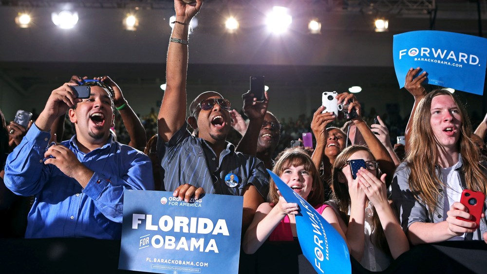 Supporters cheer for U.S. President Barack Obama at a campaign rally, Sept, 8, 2012.