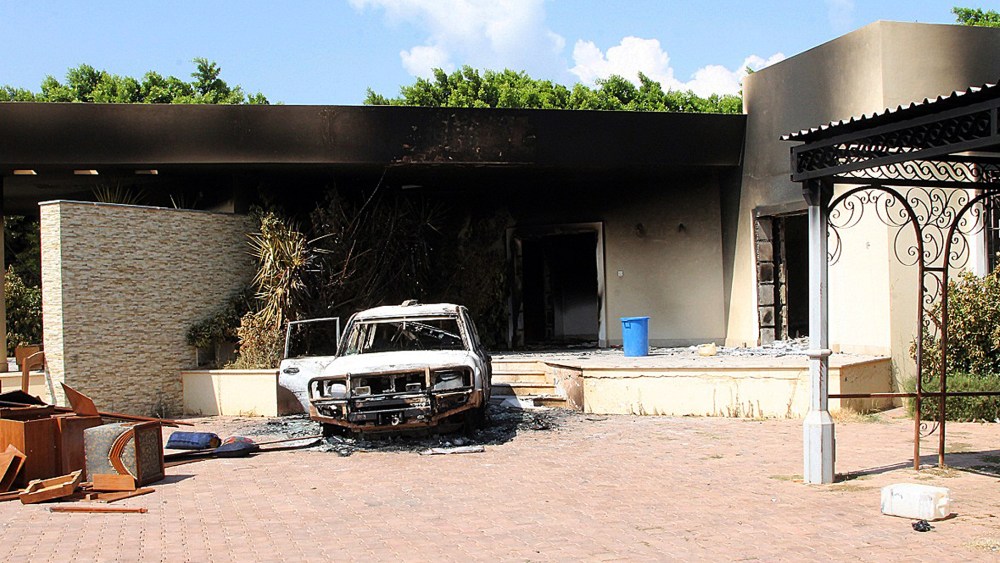 A burnt house and a car are seen inside the US Embassy compound in Benghazi following an overnight attack on the building, Sept. 12, 2012.