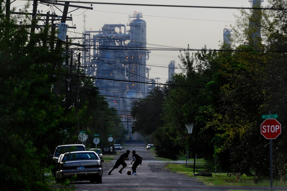 Oil facilities loom in the background of Port Arthur, Texas, which is the end of the line for oil that would travel through the proposed Keystone XL Pipeline.