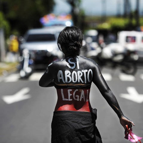 A woman participates in a march on the International Day of Action for the Decriminalization of Abortion, on September 28, 2012 in San Salvador.