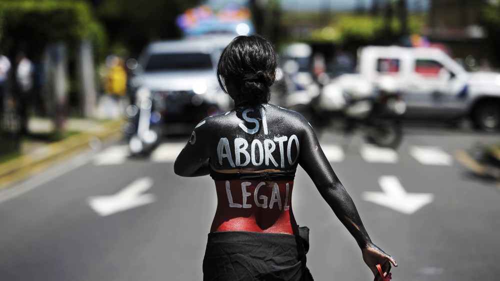 A woman participates in a march on the International Day of Action for the Decriminalization of Abortion, on September 28, 2012 in San Salvador.