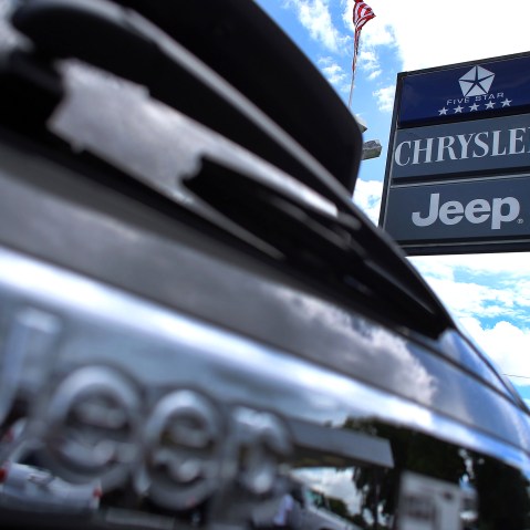 A Chrysler Jeep sign is seen outside a Chrysler Jeep car dealership in Hollywood, Fla. (Photo by Joe Raedle/Getty)