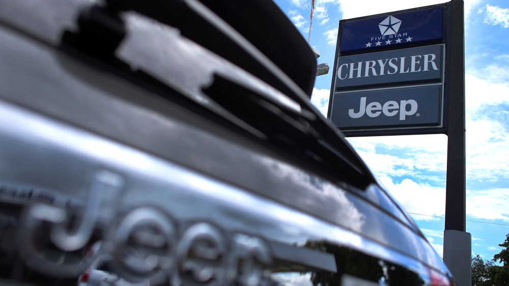 A Chrysler Jeep sign is seen outside a Chrysler Jeep car dealership in Hollywood, Fla. (Photo by Joe Raedle/Getty)