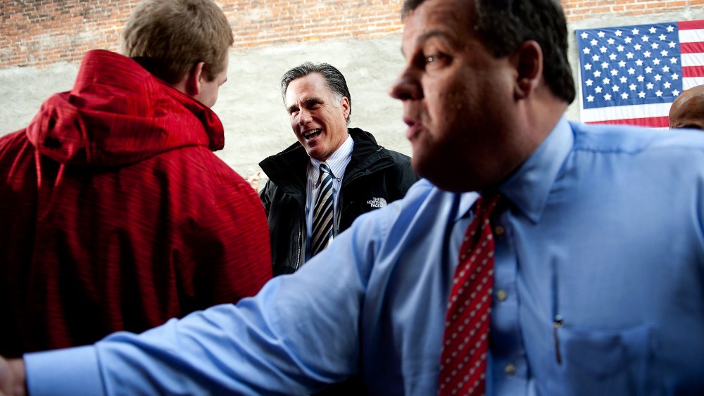 Mitt Romney and Chris Christie talk with supporters in Delaware, Ohio, October 10, 2012.