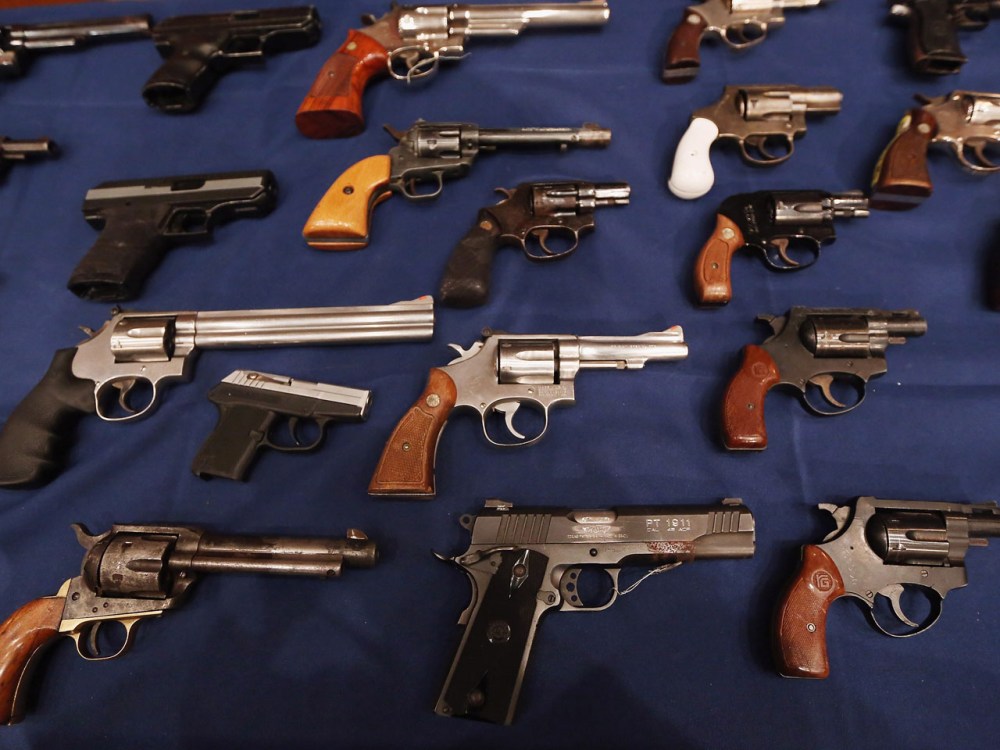 A table of illegal firearms confiscated in a large weapons bust in East Harlem are on display at a press conference on October 12, 2012 in New York City. (Mario Tama / Getty Images)