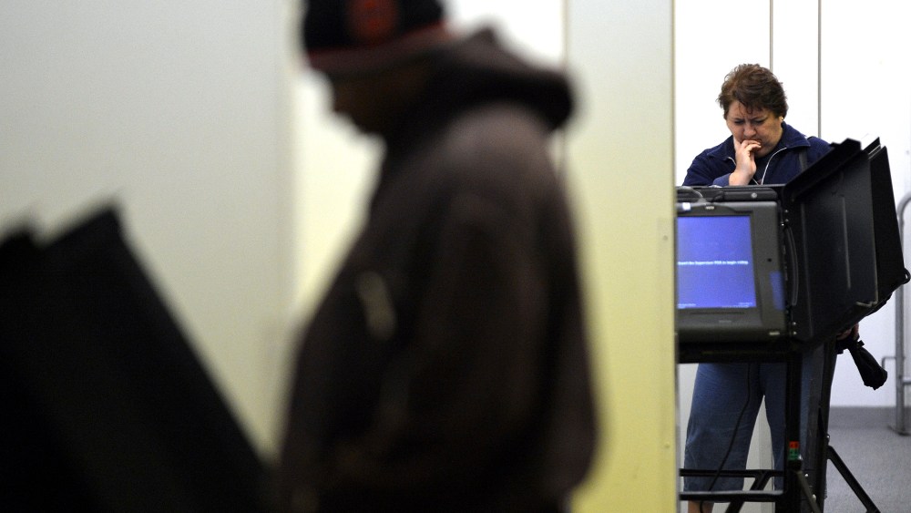 People cast their ballots for the presidential election at an early voting center in Columbus, Ohio, on Oct. 15, 2012.
