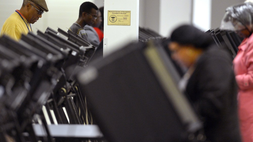 People cast their ballots for the US presidential election at an early voting center in Columbus, Ohio, on Oct. 15, 2012.