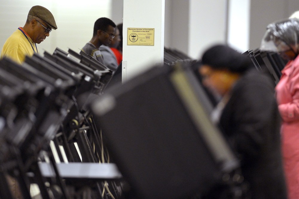 People cast their ballots for the US presidential election at an early voting center in Columbus, Ohio, on Oct. 15, 2012.