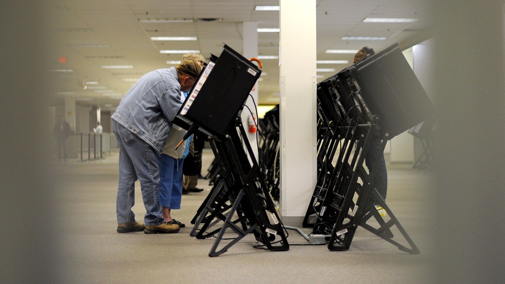 People cast their ballots for the US presidential election at an early voting center, Oct. 15, 2012, in Columbus, Ohio.