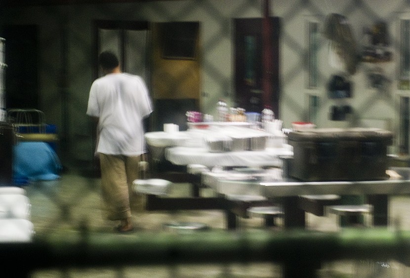 This image reviewed by the US military shot through a one way mirror shows a detainee in Cell Block B of the "Camp Six" detention facility of the Joint Detention Group at the US Naval Station in Guantanamo Bay, Cuba, January 19, 2012.  (Photo by Jim...