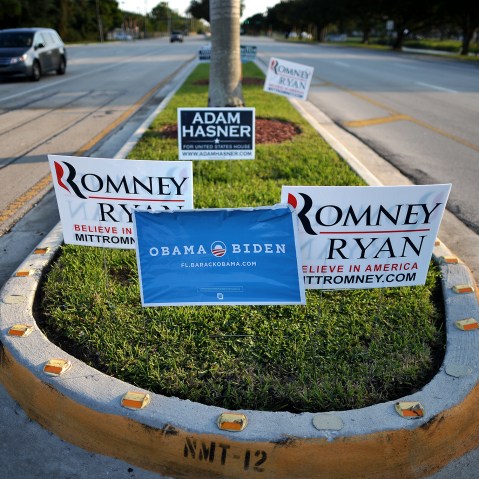 Competing signs for US President Barack Obama and his Republican rival Mitt Romney are seen in Boca Raton, Fl., on Oct. 20, 2012.