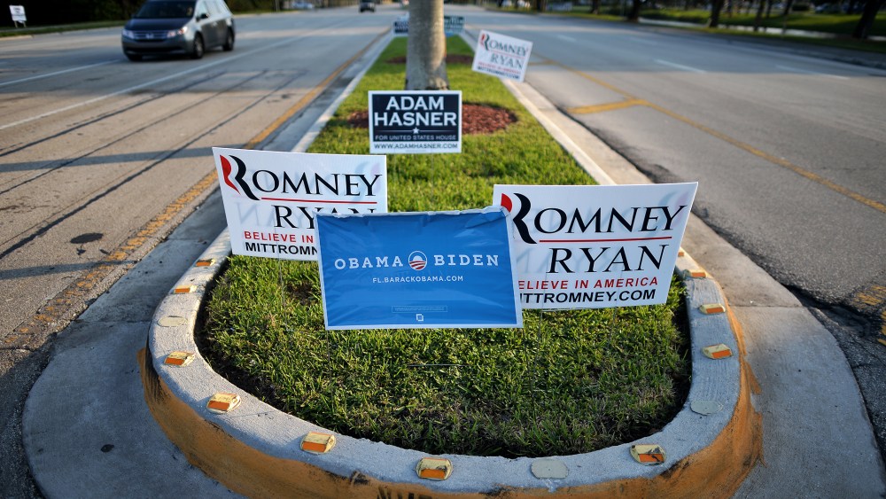 Competing signs for US President Barack Obama and his Republican rival Mitt Romney are seen in Boca Raton, Fl., on Oct. 20, 2012.