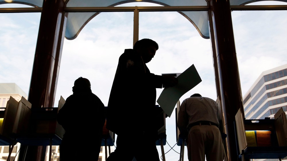 Milwaukee residents cast their ballots during early voting at the Milwaukee Municipal Building Oct. 22, 2012 Milwaukee, Wis.
