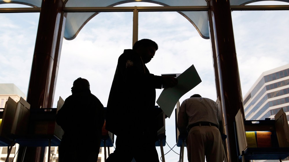 Milwaukee residents cast their ballots during early voting at the Milwaukee Municipal Building Oct., 22, 2012 Milwaukee, Wis. (Photo by Darren Hauck/Getty)