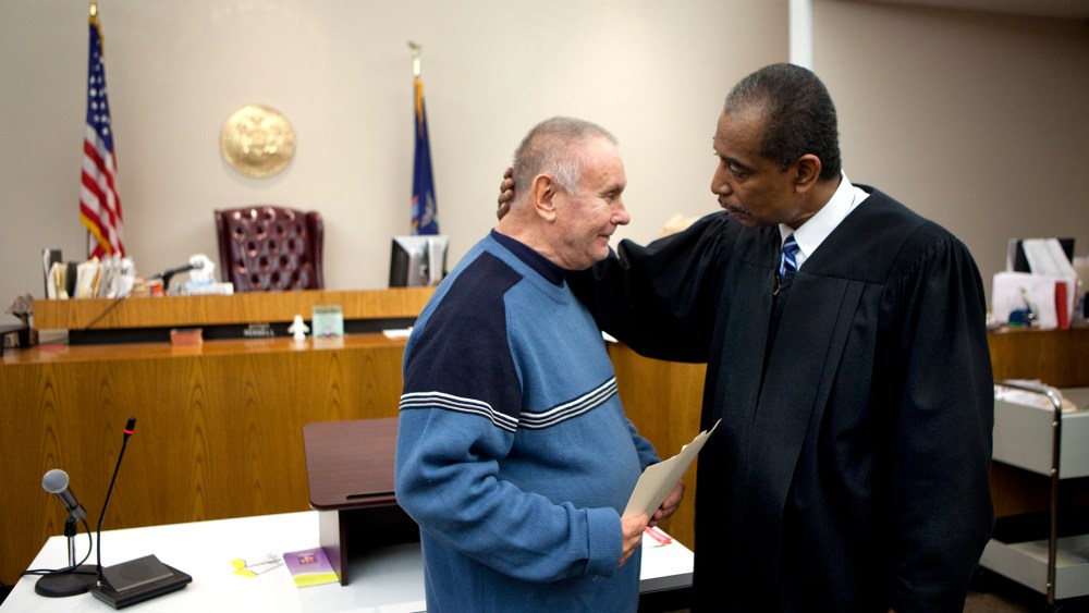 Veteran Richard Wilkiewicz (L) is congratulated by Judge Robert Russell at the Buffalo Veterans Treatment Court as he successfully completed his program, on Oct. 23, 2012 in Buffalo, New York.
