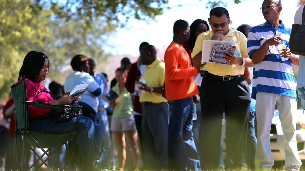People wait in line to vote at the North Miami Public Library on Nov. 1, 2012 in North Miami, Fl.