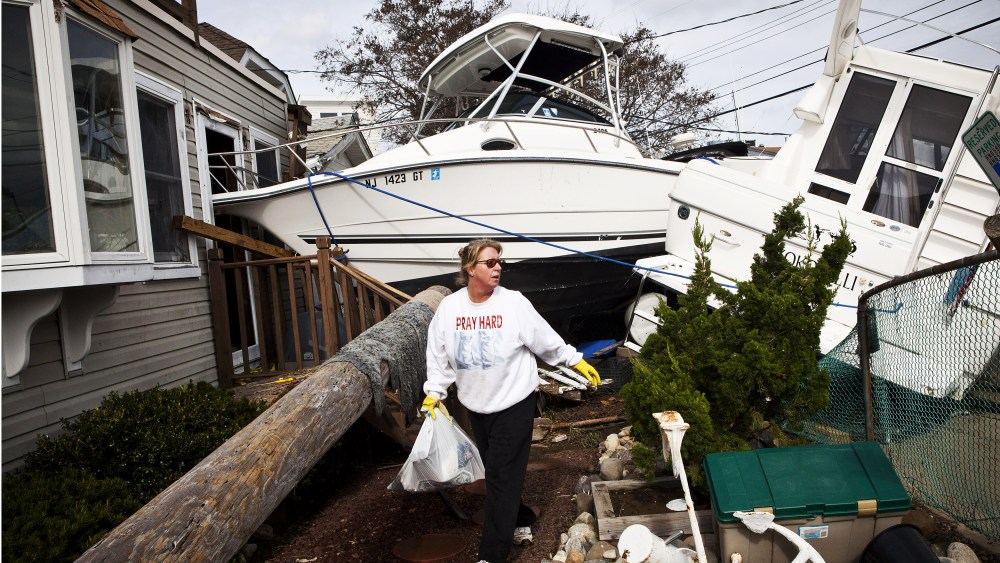 Regina Yahara-Splain cleans out her home after it was damaged by Superstorm Sandy on November 1, 2012 in Highlands, New Jersey.