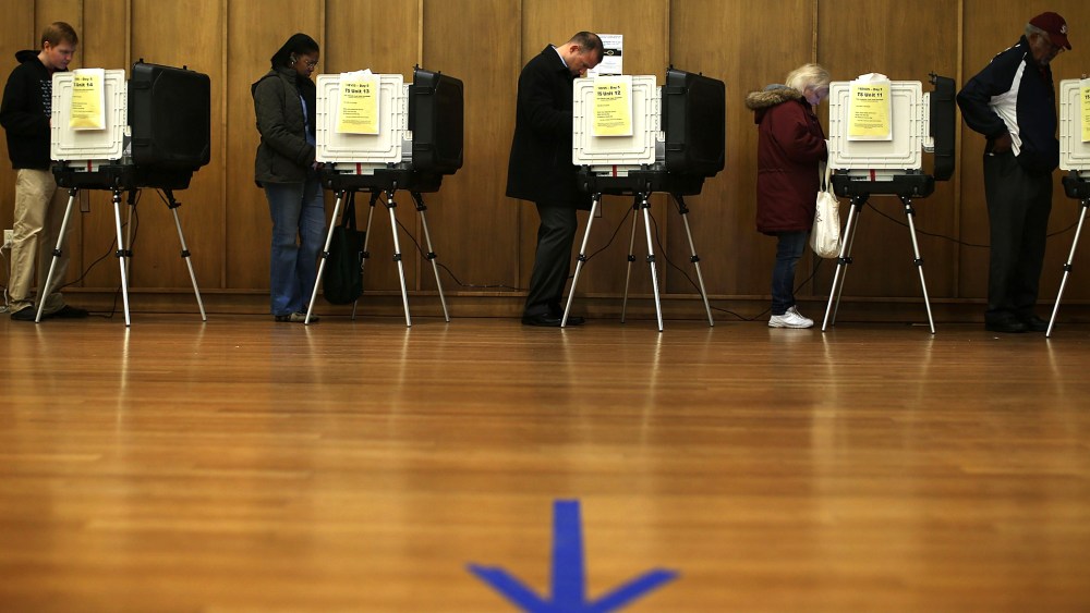 Voters cast their ballots as they participate in early voting, Nov. 2, 2012 in Silver Spring, Maryland.