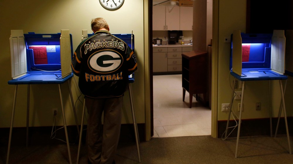 Voters cast their vote in the Presidential elections on November, 6, 2012 in Janesville, Wisconsin.