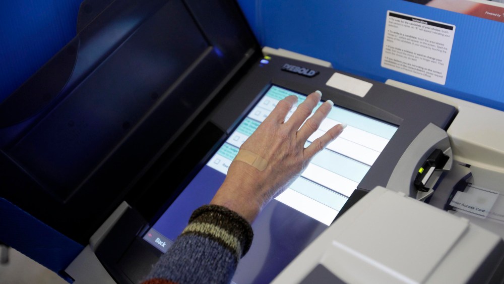 File Photo: A ballot is filled using an electronic voting machine November 6, 2012 in Portage, Ohio. (Photo by J.D. Pooley/Getty Images, File)