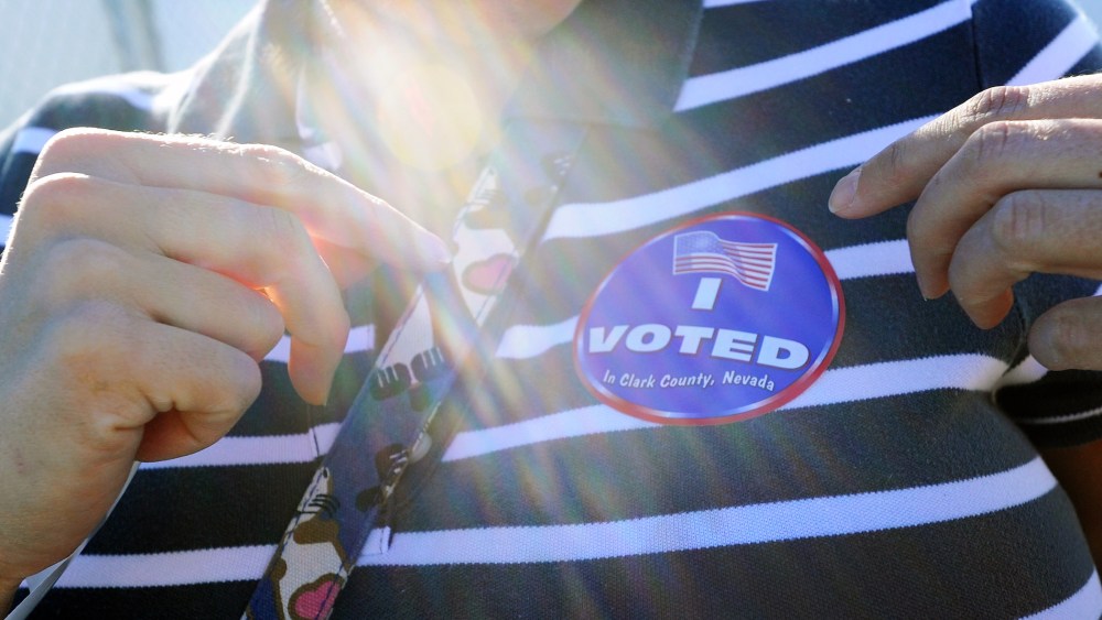 Amey Esparza puts her "I Voted" sticker on after casting her ballot at John Fremont Middle School on November 6, 2012 in Las Vegas, Nevada.