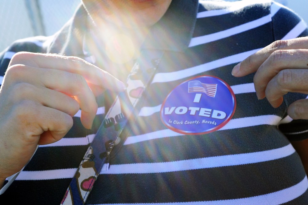 Amey Esparza puts her "I Voted" sticker on after casting her ballot at John Fremont Middle School on November 6, 2012 in Las Vegas, Nevada.