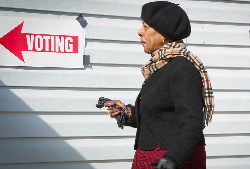 A voter walks toward the polling station to cast her ballot at the Nativity's "Don Bosco" youth center in Washington, DC on November 6, 2012. (Photo by Mladen Antonov/AFP/Getty Image)