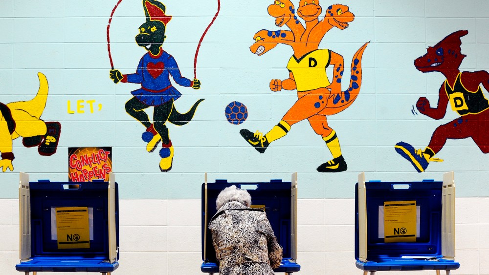 A voter casts her ballot in the gymnasium of Douglas Elementary School on Nov. 6,  2012 in Raleigh, N.C